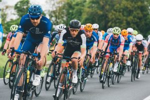 Male bikers wearing sports straps for eyewear.